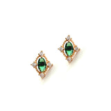 The Destiny Earrings by LLUME Jewelry are gold studs with central oval emerald green gems, accented by small white stones in a square arrangement for an elegant, jewel-toned look.